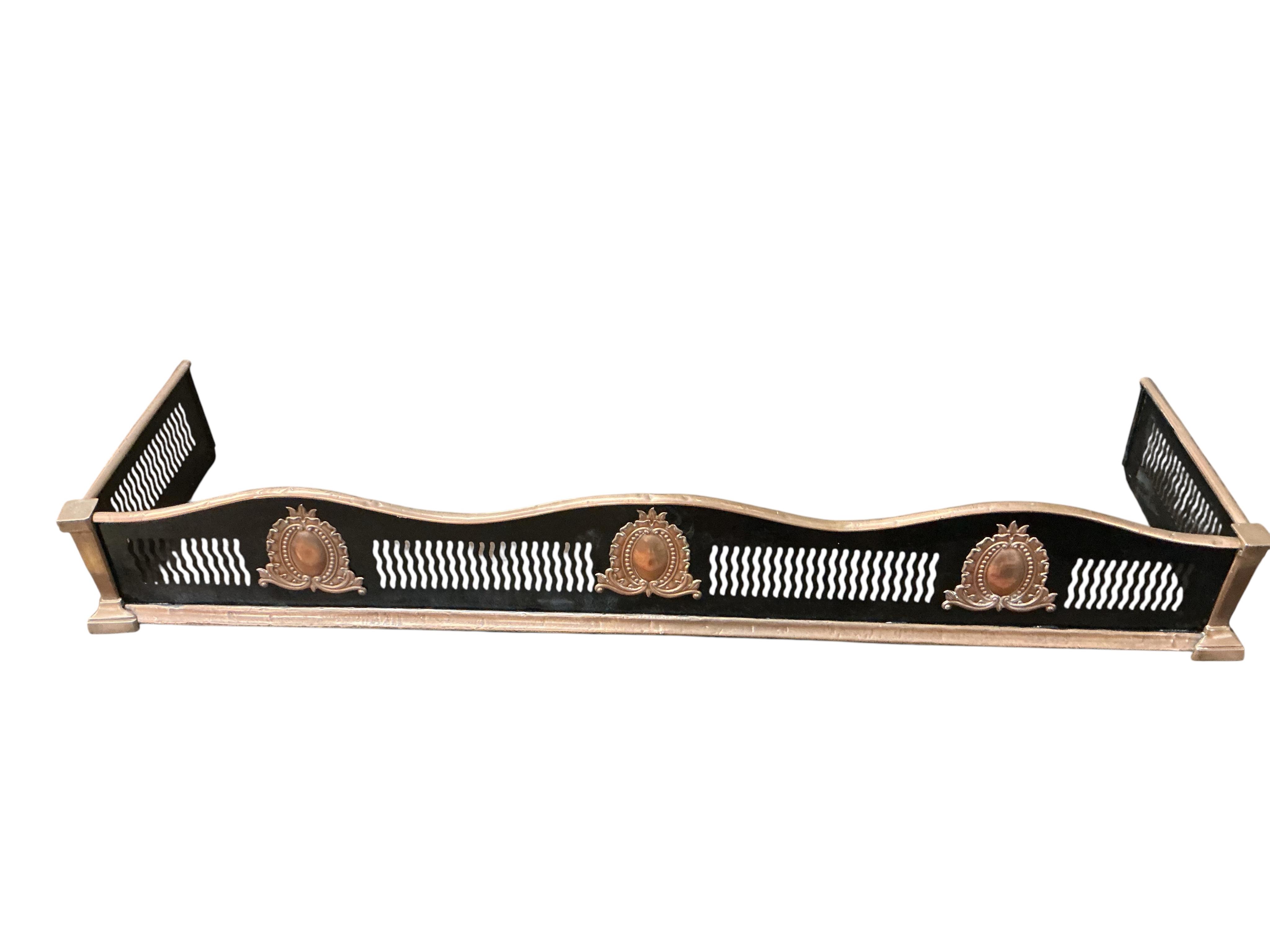 A 19th century copper mounted iron kerb, a set of carved oak bellows together with a collection of Victorian and later copper and brass ware